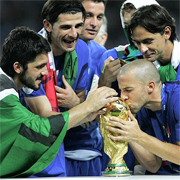 Italian midfielder Gennaro Gattuso stripped down to his underwear, wrapped himself in the Italian flag and danced in front of the jubilant Italian fans under a shower of fireworks and silver confetti. A few feet away, his teammates formed a circle and danced around Mauro Camoranesi, who was sitting on a folding chair with a pair of scissors in his hand. Seconds later, Camoranesi's long ponytail was chopped off and in his hand, held aloft for all to see.